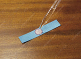 Cobalt chloride paper with drop of water